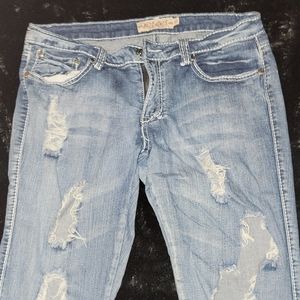 Pair of size 9/10 distressed ripped crop jeans. With gold embroidery pockets